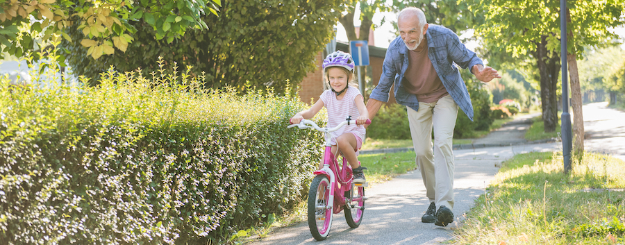 A young girl riding her bike