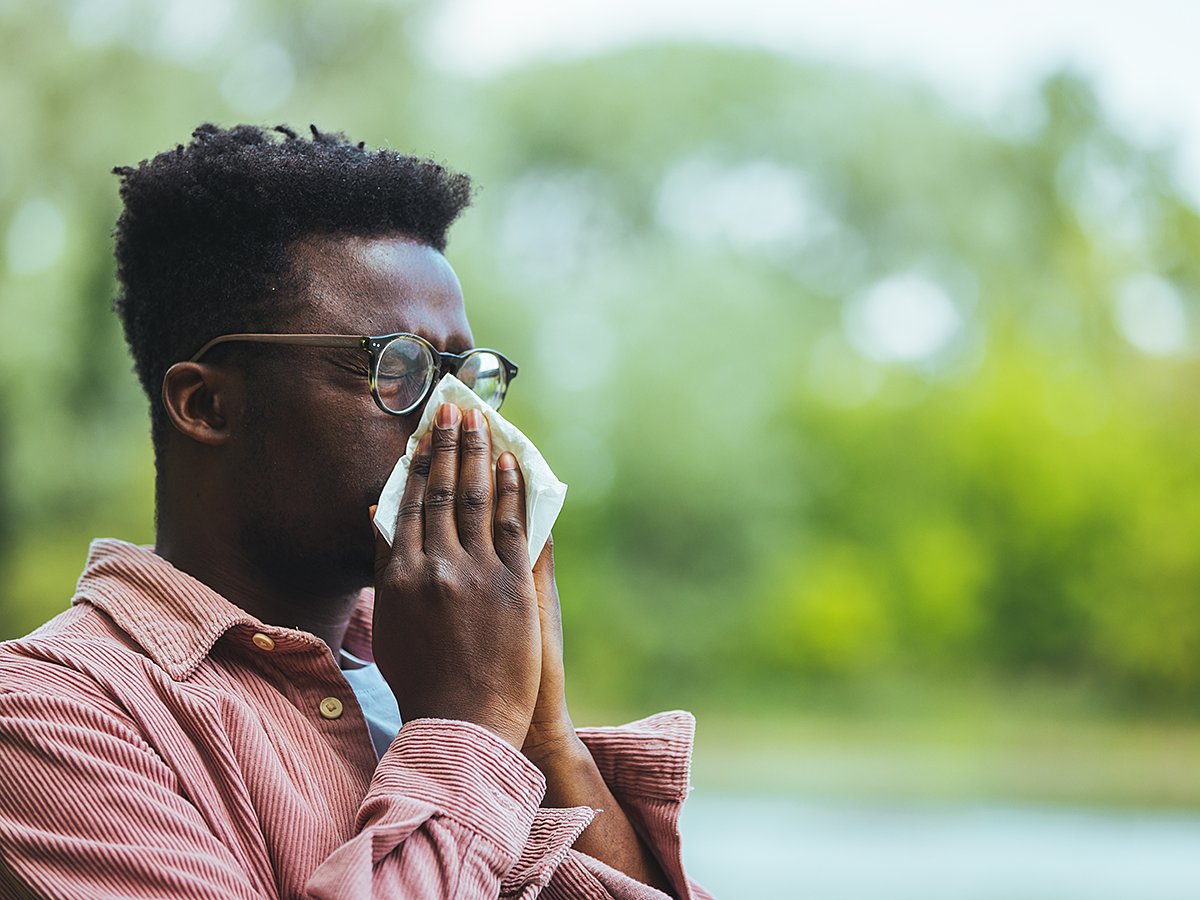 allergies sneezing man