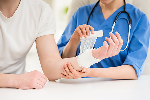 Patient getting her arm wrapped