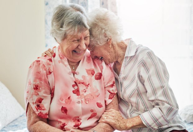 Two elderly women laughing