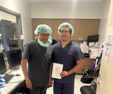Drs Trinidad and Desai holding a Barostim sign