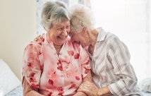 Two elderly women laughing